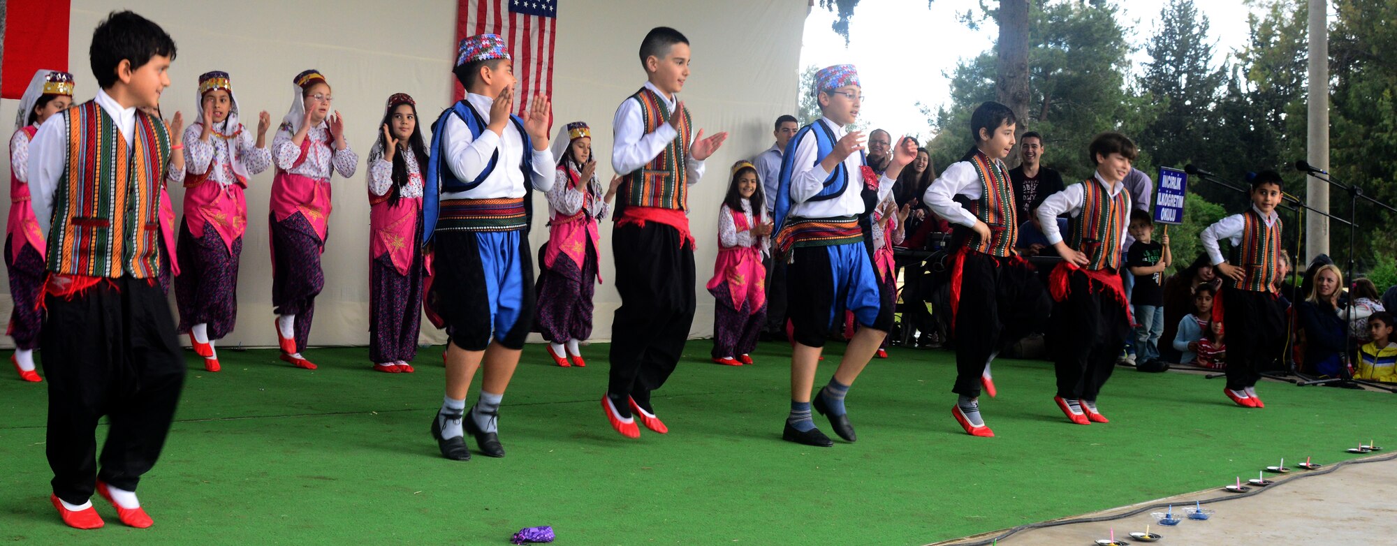 A group of young Turkish boys and girls perform for audience members during the Children’s Day Festival April 21, 2013, at Arkadas Park, Incirlik Air Base, Turkey. The event was hosted by the Turkish air force 10th Tanker Base Command and was open to all members of Team Incirlik. In 1979, the United Nation’s Year of the Child and the Turkish government proposed April 23 be declared a holiday for children of the world. That same year, Turkey began inviting children from every country to participate in Children’s Day festivities. (U.S. Air Force photo by Staff Sgt. Eric Summers Jr./Released)