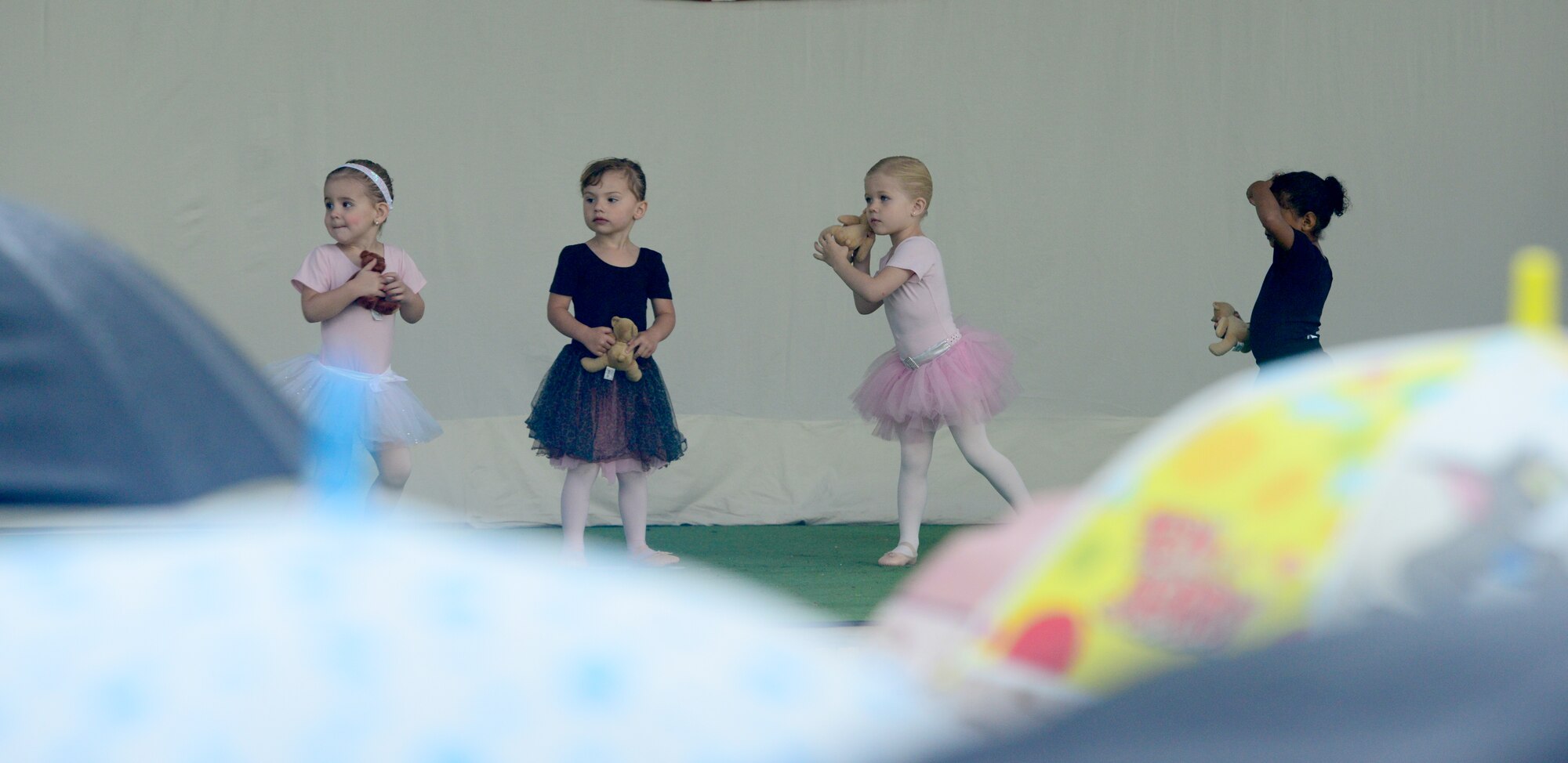Young ballerinas perform a routine for a mixed audience of Turkish and American members during the Children’s Day Festival April 21, 2013, at Arkadas Park, Incirlik Air Base, Turkey. The event offered an opportunity for camaraderie and building partnership between Turkish and American service members and civilians. (U.S. Air Force photo by Staff Sgt. Eric Summers Jr./Released)