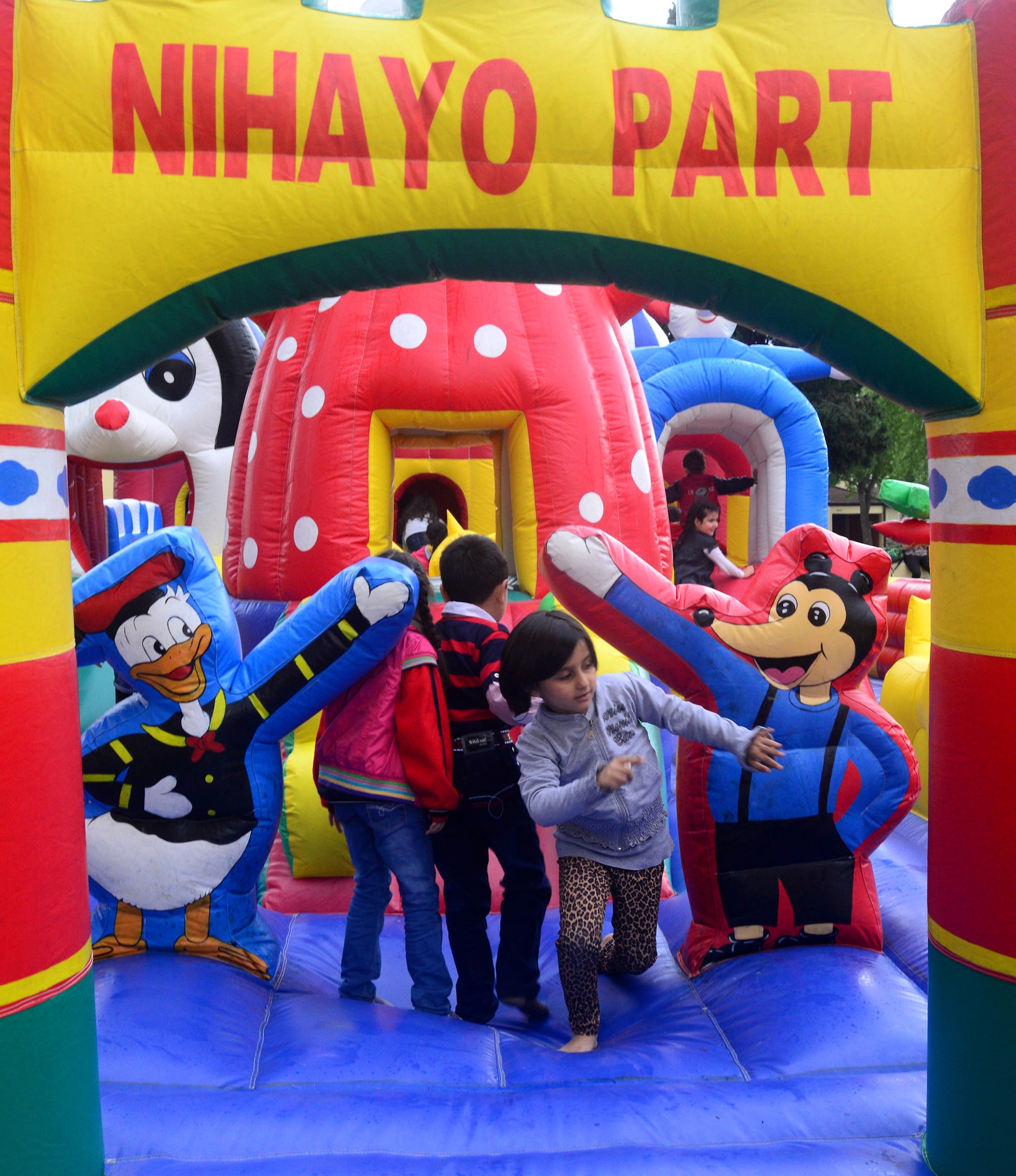 Children bounce and play in blow up castle during a Children’s Day Festival April 21, 2013, at Arkadas Park, Incirlik Air Base, Turkey. The event was hosted by the Turkish air force 10th Tanker Base Command and was open to all members of Team Incirlik. The event featured activity booths, games and performances designed to honor children and celebrate cultures coming together. In 1979, the United Nation’s Year of the Child, the Turkish government proposed April 23 be declared a holiday for children of the world. That same year, Turkey began inviting children from every country to participate in Children’s Day festivities. (U.S. Air Force photo by Staff Sgt. Eric Summers Jr./Released)