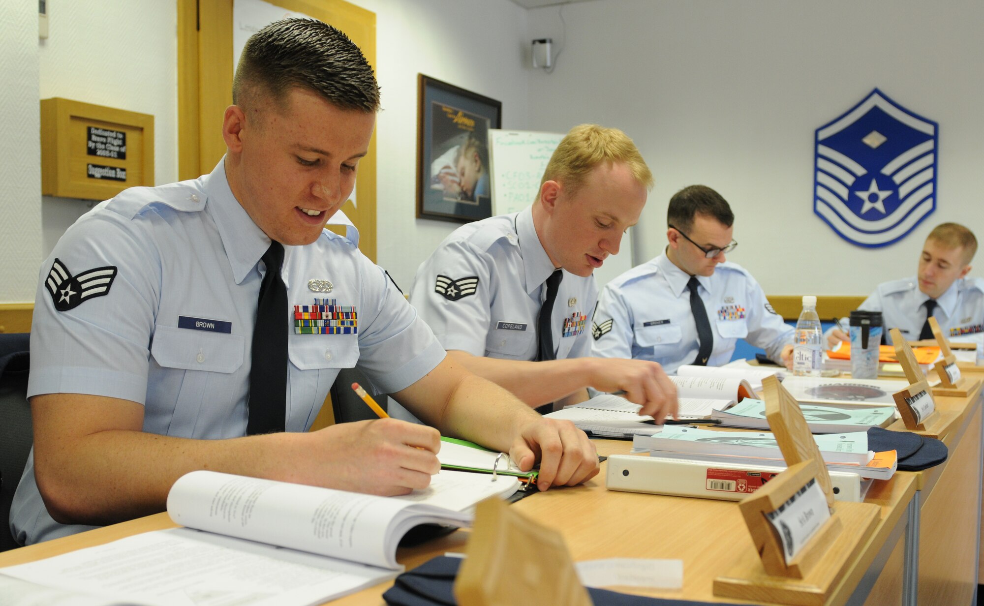 Senior Airman Matthew Brown, 86th Munitions Squadron munitions system technician, reads information about operations security during an airman leadership class block of study, April 22, 2013, Kapaun, Germany. Brown was recently awarded the Conventional Munitions Systems Maintainer Technician of the Year for U.S. Air Forces in Europe and Air Forces Africa. (U.S. Air Force photo/Airman 1st Class Holly Cook)