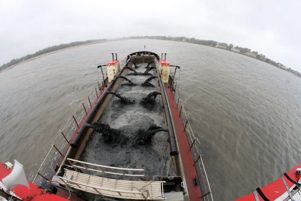 SUFFOLK, Va. -- Pumps from the Army Corps of Engineers’ hopper dredge Currituck, based out of Wilmington, N.C., filters sand from Bennett's Creek to increase the depth from 2- to 6-feet. The shallow draft dredging of the federal navigation channel here began April 20, 2013. Approximately 4,000 cubic yards of sand - equivalent to 450 dump trucks of sand – will be placed at the Craney Island Dredged Material Management Area in Portsmouth, Va.