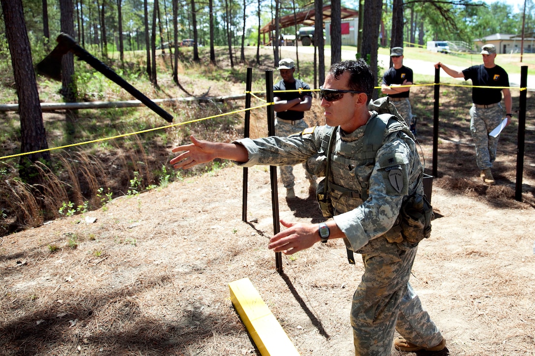 Army Sgt. 1st Class Timothy S. Briggs throws a Tomahawk during the 30th annual Best Ranger Competition on Fort Benning, Ga., April 13, 2013. Briggs is assigned to the Ranger Training Brigade.