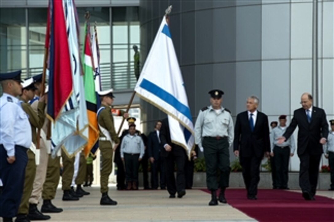 Secretary of Defense Chuck Hagel, second from right, is given an honors arrival by Israeli Minister of Defense Moshe Ya'alon, right, in Tel Aviv, Israel, on April 22, 2013.  Hagel will spend several days in Israel meeting with counterparts on a six-day trip to the Middle East.  