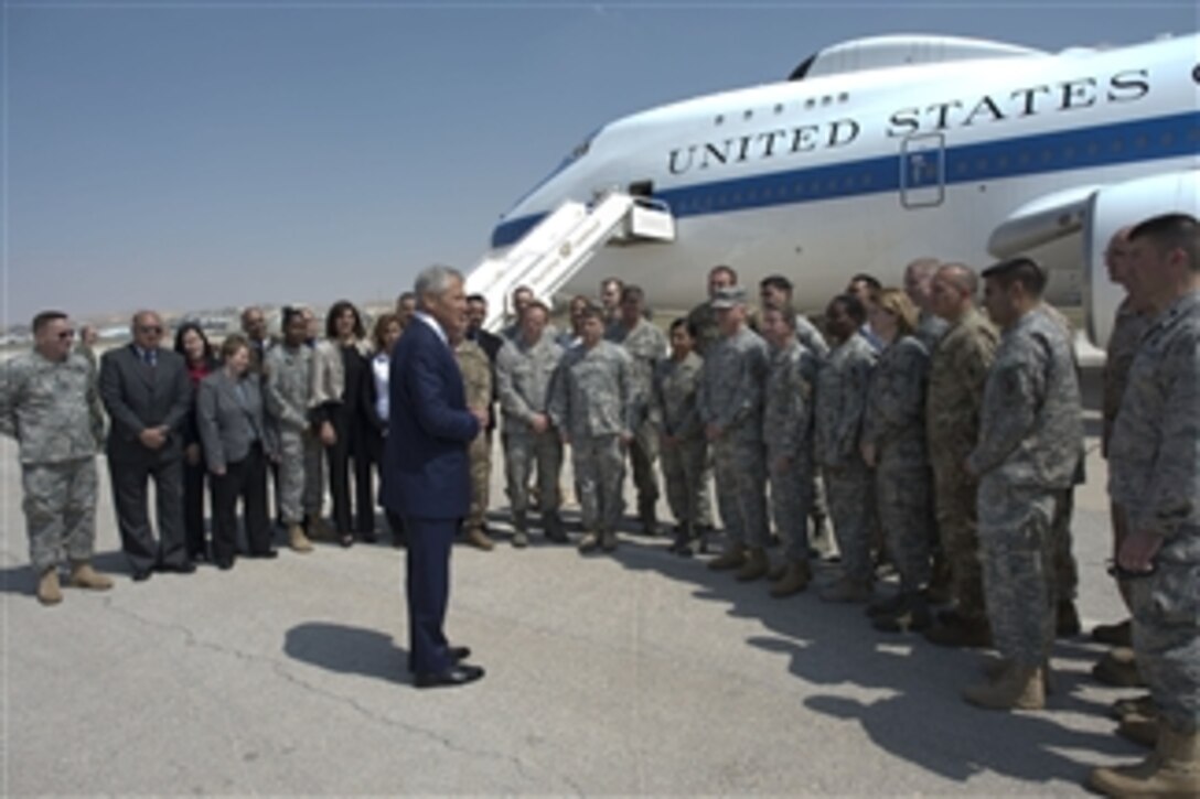 Secretary of Defense Chuck Hagel talks U.S. troops and civilians on the tarmac in Amman, Jordan, on April 23, 2013.  Hagel used the opportunity to personally thank them for their service.  Hagel stopped briefly in Amman to meet with defense leaders while on a six-day trip to the Middle East.  