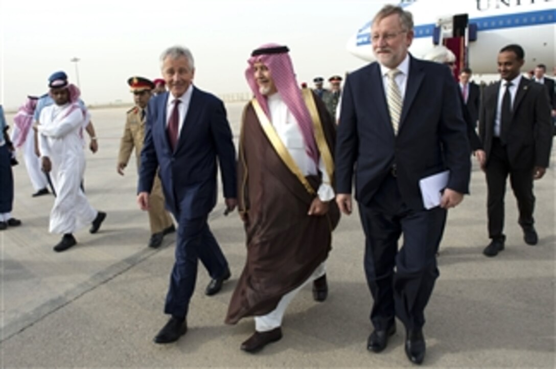 Secretary of Defense Chuck Hagel, third from left, walks with Saudi Deputy Minister of Defense Prince Fahd bin Abdullah, center, and U.S. Ambassador to the Kingdom of Saudi Arabia Jim Smith, after arriving in Riyadh, Saudi Arabia, on April 23, 2013.  The Kingdom of Saudi Arabia is Hagel's third stop on a six-day trip to the Middle East.  