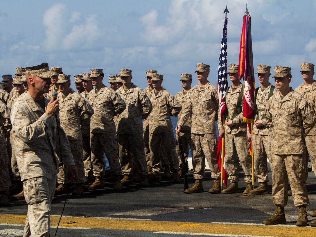 U.S. Marines and Sailors with the 26th Marine Expeditionary Unit stand in formation before a birthday cake cutting ceremony to celebrate the MEU’s 46th birthday aboard the amphibious assault ship USS Kearsarge (LHD 3), April 24, 2013.  Currently deployed to the 5th Fleet Area of Responsibility, the 26th MEU operates continuously across the globe, providing the president and unified combatant commanders with a forward-deployed, sea-based quick reaction force. The MEU is a Marine Air-Ground Task Force capable of conducting amphibious operations, crisis response and limited contingency operations. (U.S. Marine Corps photo by Cpl. Kyle N. Runnels/Released)