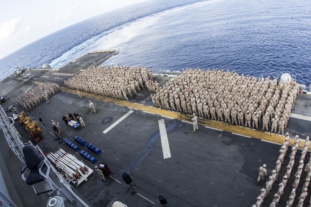 U.S. Marines and Sailors with the 26th Marine Expeditionary Unit conduct a birthday cake cutting ceremony to celebrate the MEU’s 46th birthday aboard the amphibious assault ship USS Kearsarge (LHD 3), April 24, 2013.  The 26th MEU is deployed to the 5th Fleet area of operations aboard the Kearsarge Amphibious Ready Group. The 26th MEU operates continuously across the globe, providing the president and unified combatant commanders with a forward-deployed, sea-based quick reaction force. The MEU is a Marine Air-Ground Task Force capable of conducting amphibious operations, crisis response and limited contingency operations. (U.S. Marine Corps photograph by Gunnery Sgt. Michael Kropiewnicki/26th MEU Combat Camera/Released)