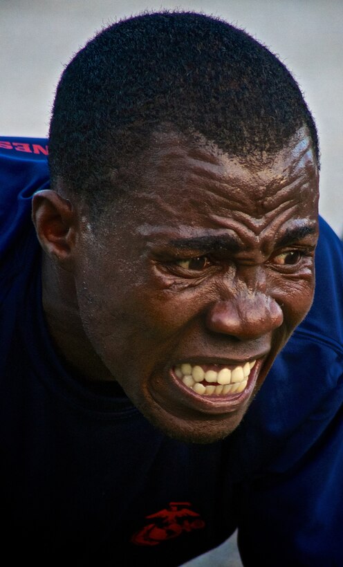 Peterson Septimus, a future Marine in the delayed entree program from Delray Beach, Fla., feels the pain of Marine Corps pushups during physical training with Recruiting Substation Delray Beach Feb. 5, 2013. With a high volume of future Marines remaining in the delayed entree program for up to 11 months, it is important that recruiters lead their pool as they would lead their junior Marines in the fleet through mentorship. 