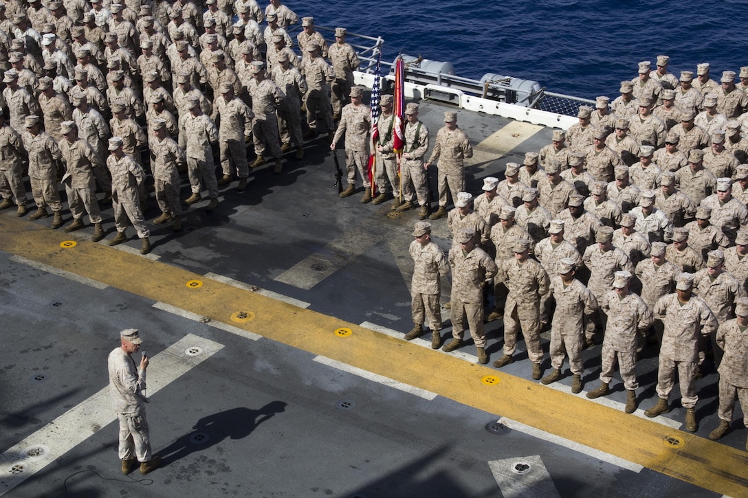 Col. Matthew St. Clair, 26th Marine Expeditionary Unit (MEU) commanding officer, speaks to U.S. Marines and Sailors during the birthday cake cutting ceremony to celebrate the MEU’s 46th birthday aboard the amphibious assault ship USS Kearsarge (LHD 3), April 24, 2013.  The 26th MEU is deployed to the 5th Fleet area of operations aboard the Kearsarge Amphibious Ready Group. The 26th MEU operates continuously across the globe, providing the president and unified combatant commanders with a forward-deployed, sea-based quick reaction force. The MEU is a Marine Air-Ground Task Force capable of conducting amphibious operations, crisis response and limited contingency operations. (U.S. Marine Corps photograph by Gunnery Sgt. Michael Kropiewnicki/26th MEU Combat Camera/Released)