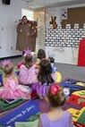 The Marine Corps Air Station Library celebrates National Library Week be re-enacting “The Paper Bag Princess” as a recording of the author, Robert Munsch, reads to the children, April 16. The library also had a puppet show of “The Princess and The Pea” and gave children wands and cups with red streamers or aluminum foil hooks so they could color them in and pretend they were princesses or fire-breathing dragons. The library also supplied handcrafted scenes from storybooks and props so kids could take pictures.