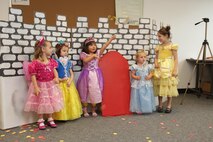 The Marine Corps Air Station Library celebrates National Library Week be re-enacting “The Paper Bag Princess” as a recording of the author, Robert Munsch, reads to the children, April 16. The library also had a puppet show of “The Princess and The Pea” and gave children wands and cups with red streamers or aluminum foil hooks so they could color them in and pretend they were princesses or fire-breathing dragons. The library also supplied handcrafted scenes from storybooks and props so kids could take pictures.
