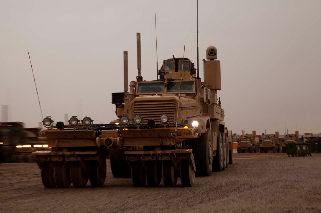 Marines assigned to Mobile Assault Company, 2nd Combat Engineer Battalion, leave on a convoy mission from Camp Leatherneck, Helmand province, Afghanistan on Dec. 7, 2012. The Marines of 2nd CEB supported Regimental Combat Team 7 and the Security Forces Assistance mission in Helmand province. (U.S. Marine Corps photo by Cpl. Alejandro Pena)