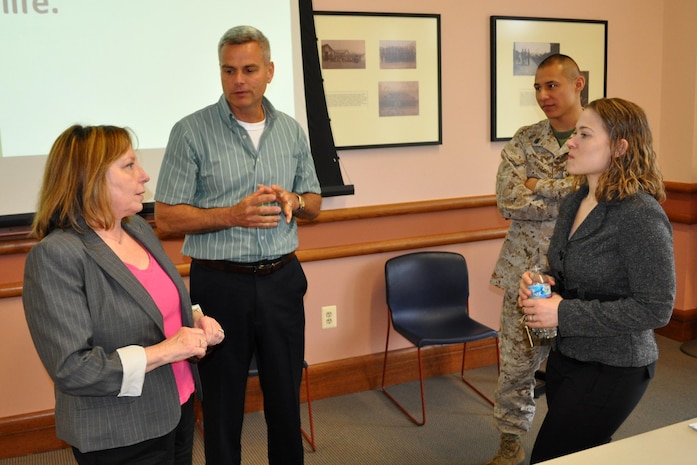 Cindy Davis (left), Marine Corps Foreign Disclosure program manager, speaks to Mike Ansley, Marine Corps Systems Command’s Foreign Disclosure team lead, and Staff Sgt. Antonio Navarro and Christina Balocki of the Director of Marine Corps Intelligence at Headquarters Marine Corps, during the 2013 Marine Corps Foreign Disclosure Working Group meeting. MCSC hosted the annual gathering for foreign disclosure officers and personnel who work foreign disclosure issues. The event took place April 16-18 at the Gray Research Center, Quantico, Va. 