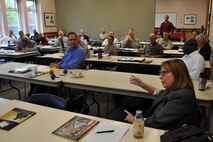 Cindy Davis (right front), Marine Corps Foreign Disclosure program manager, makes a point during the 2013 Marine Corps Foreign Disclosure Working Group meeting. MCSC hosted the annual gathering for foreign disclosure officers and personnel who work foreign disclosure issues. The event took place April 16-18 at the Gray Research Center, Quantico, Va.