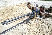 Pfc. Bryan Munoz, Marine Wing Support Squadron 272 engineer mechanic, defends the perimeter of the landing field with an M2 .50 caliber machine gun during a field training exercise aboard Marine Corps Base Camp Lejeune, April 17. Marines With Marine Wing Support Squadron 272 took to the field to hone the skills learned during Marine Combat Training and to practice airbase ground defense, one of the squadron’s mission essential tasks. 

