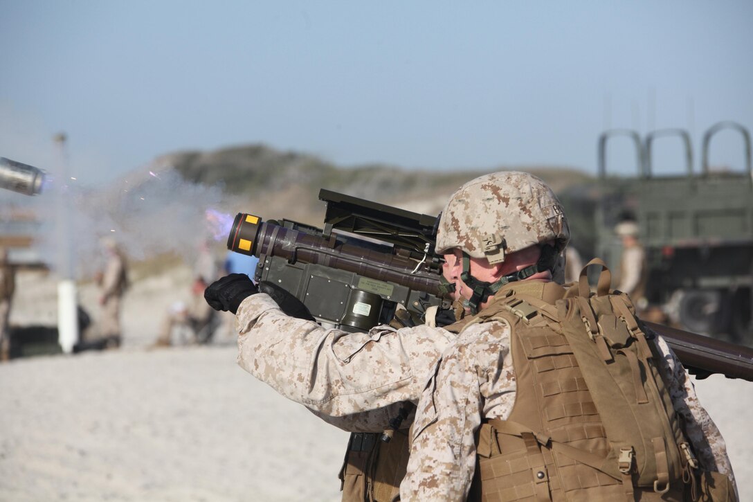 Flames blow out of the launcher as Cpl. Nicholas Zeien, a gunner with 2nd Low Altitude Air Defense Battalion, fires a PL-87 Stinger missile at a drone flying off of Onslow Beach on Camp Lejeune during the second day of the battalion’s live-fire exercise April 17. The Stinger has a range of more than 6 kilometers and weighs more than 34 pounds. The missile can be fired from the shoulder firing system, a vehicle-mounted firing system or an aircraft.