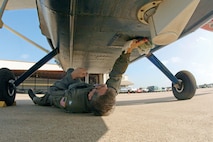 A Civil Air Patrol pilot cleans the outer window of the Airborne Real-time Cueing Hyperspectral Enhanced Recon System before an ARCHER mission. Photo courtesy of Civil Air Patrol 
