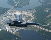 A U.S. Air Force jet flies over NASA's Cape Canaveral recently. NORAD and USNORTHCOM routinely provide military support to NASA shuttle launches, ensuring airspace safety and security for the launch and landing by enforcing the FAA's Temporary Flight Restriction zones.