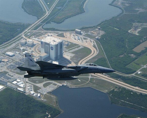 A U.S. Air Force jet flies over NASA's Cape Canaveral recently. NORAD and USNORTHCOM routinely provide military support to NASA shuttle launches, ensuring airspace safety and security for the launch and landing by enforcing the FAA's Temporary Flight Restriction zones.