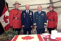 North American Aerospace Defense Command deputy commander, Lt.-Gen. Rick Findley, second from right, hosted the annual Canada Day Garden Party in Colorado Springs, Colo., on July 1, 2007. Joining him were NORAD and U.S. Northern Command commander, Gen. Gene Renuart, second from left, and Royal Canadian Mounted Police representatives. Canadian and military guests celebrated Canada's 140th birthday at the annual social event that is sponsored by the Government of Canada through the Department of National Defense. The Garden Party provides an opportunity for the Canadian Forces assigned to NORAD to thank local leaders for their support to the Canadian Forces families. Photo by Petty Officer 2nd Class Jhomil Bansil 