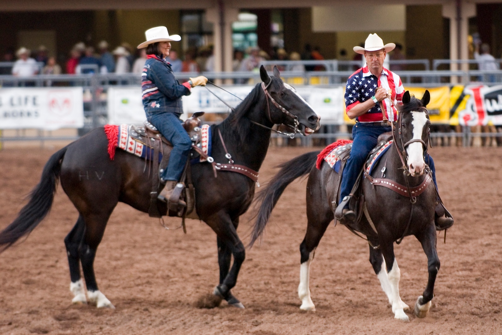 Gen. Gene Renuart, commander of North American Aerospace Defense Command and U.S. Northern Command, and his wife, Jill Renuart, kick off the July 12, 2007, performance of the Pikes Peak or Bust Rodeo in Colorado Springs, Colo. The rodeo is a charitable organization dedicated to funding programs and services that benefit local military personnel and their families. Photo by Sgt. 1st Class Gail Braymen 