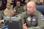 Gen. Gene Renuart, commander of North American Aerospace Defense Command and U.S. Northern Command, discusses the progress of several ongoing missions during the Aug. 20, 2007, commander's update briefing at NORAD and USNORTHCOM headquarters. This month, the two military commands have supported the space shuttle launch and landing, recovery efforts at the collapsed bridge in Minneapolis, rescue operations at Utah's Crandall Canyon mine, Russian bomber monitoring and Hurricane Dean response preparations. Photo by Sgt. 1st Class Gail Braymen 