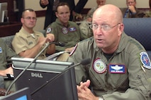 Gen. Gene Renuart, commander of North American Aerospace Defense Command and U.S. Northern Command, discusses the progress of several ongoing missions during the Aug. 20, 2007, commander's update briefing at NORAD and USNORTHCOM headquarters. This month, the two military commands have supported the space shuttle launch and landing, recovery efforts at the collapsed bridge in Minneapolis, rescue operations at Utah's Crandall Canyon mine, Russian bomber monitoring and Hurricane Dean response preparations. Photo by Sgt. 1st Class Gail Braymen 
