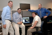 A team that developed a system that allows users at North American Aerospace Command and U.S. Northern Command to quickly and easily access detailed geospatial data has been selected to receive the 2007 United States Geospatial Foundation's achievement award in the military category. Members of the Space and Naval Warfare Center C4I Engineering Support Team are, left to right, Gary Koch, Chris Mayfield, Dave Gokey and Dave McKinley. Photo by Sgt. 1st Class Gail Braymen 