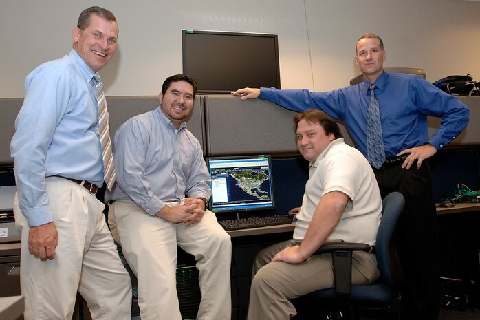 A team that developed a system that allows users at North American Aerospace Command and U.S. Northern Command to quickly and easily access detailed geospatial data has been selected to receive the 2007 United States Geospatial Foundation's achievement award in the military category. Members of the Space and Naval Warfare Center C4I Engineering Support Team are, left to right, Gary Koch, Chris Mayfield, Dave Gokey and Dave McKinley. Photo by Sgt. 1st Class Gail Braymen 
