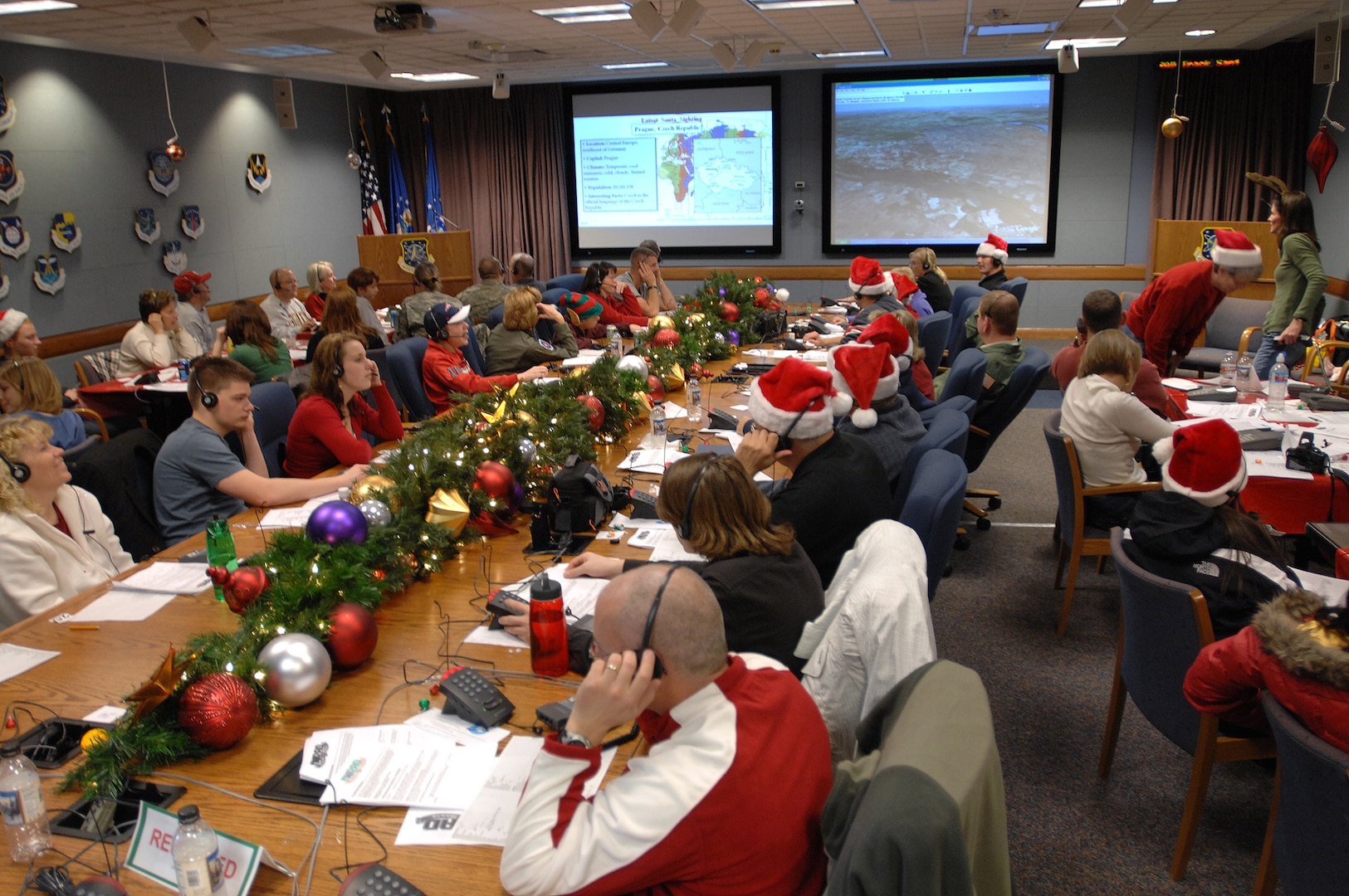 More than 1,000 military and civilian volunteers answered nearly 95,000 telephone calls and more than 10,000 e-mails at the NORAD Tracks Santa Operations Center on Christmas Eve at Peterson Air Force Base, Colo. Photo by Sgt. 1st Class Gail Braymen 