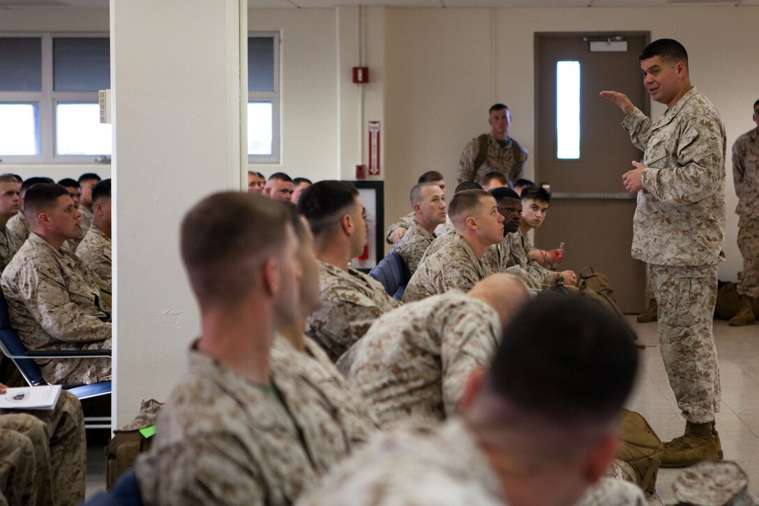 Lt. Col. Thomas D. Wood, commanding officer, 3rd Battalion, 3rd Marine Regiment speaks to his Marines here April 20 while they wait for their flight to Australia. Approximately 200 Marines and Sailors deployed to Darwin, Australia, for approximately six months as the second iteration of Marine Rotational Force-Darwin. MRF-D provides opportunities to engage in security cooperation activities, and improve disaster relief and crisis response capabilities.