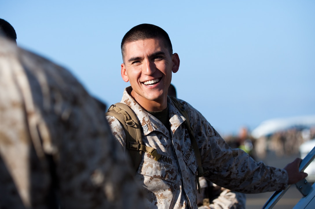 Staff Sgt. Edward W. Erdmann with Lima Company, 3rd Battalion, 3rd Marine Regiment, gets ready to board his flight here April 20. Erdmann is a part of approximately 200 Marines and Sailors who deployed to Darwin, Australia, for approximately six months as the second iteration of Marine Rotational Force-Darwin. MRF-D provides opportunities to engage in security cooperation activities, and improve disaster relief and crisis response capabilities.