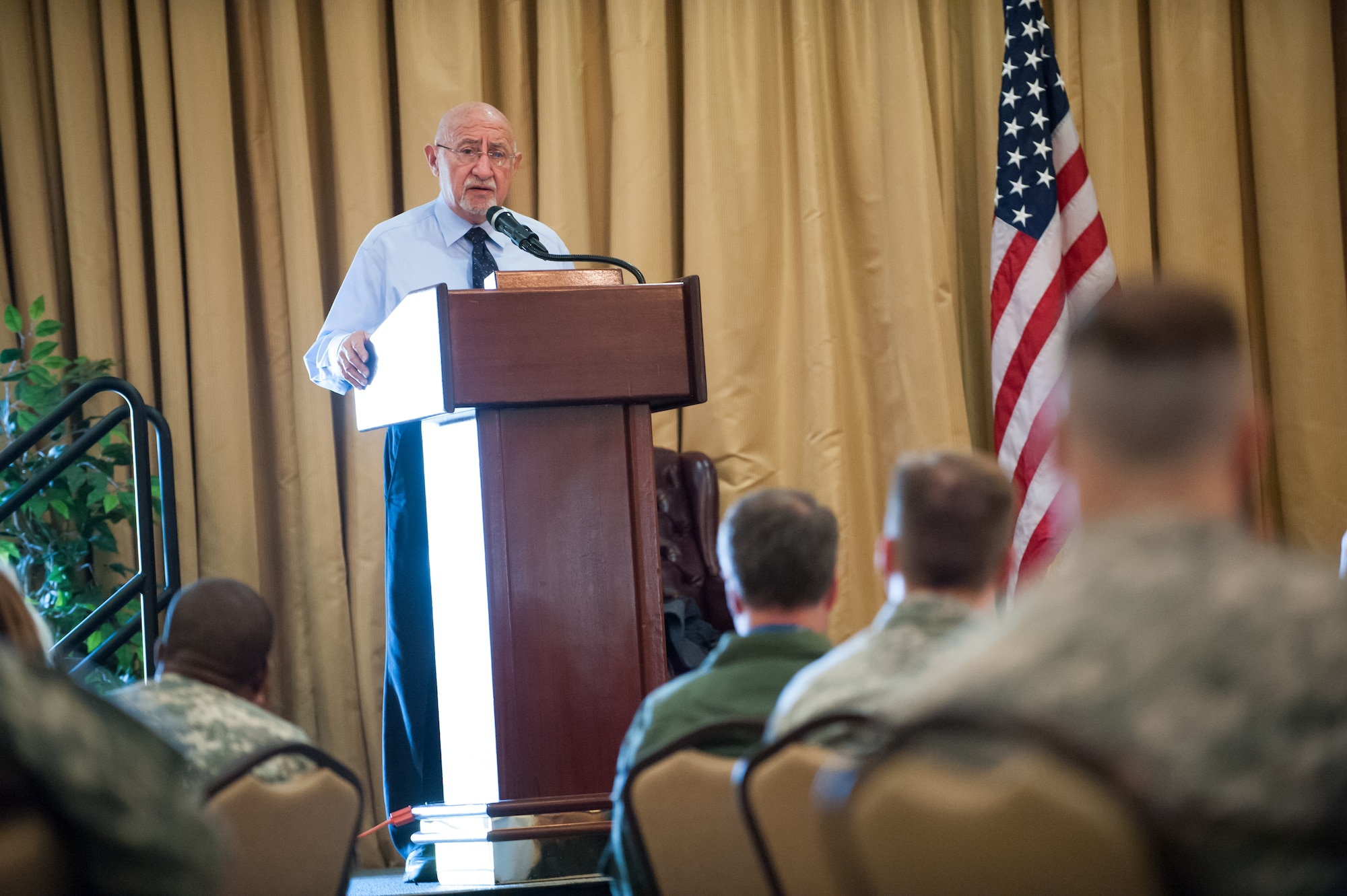 Charles Middleberg, guest speaker, talks about his experience as a Holocaust Survivor during the Holocaust Remembrance Luncheon April 16, 2013, at Tommy B's Community Activities Center on Joint Base McGuire-Dix-Lakehurst, N.J. Middleberg, who lived in France during World War II, spoke about how the Holocaust changed his life and the lives of his family. He speaks about his personal experiences throughout New Jersey for the Goodwin Holocaust Museum and Education Center in an effort to combat prejudice and hatred in today's society. (U.S. Air Force photo by Russ Meseroll/Released)