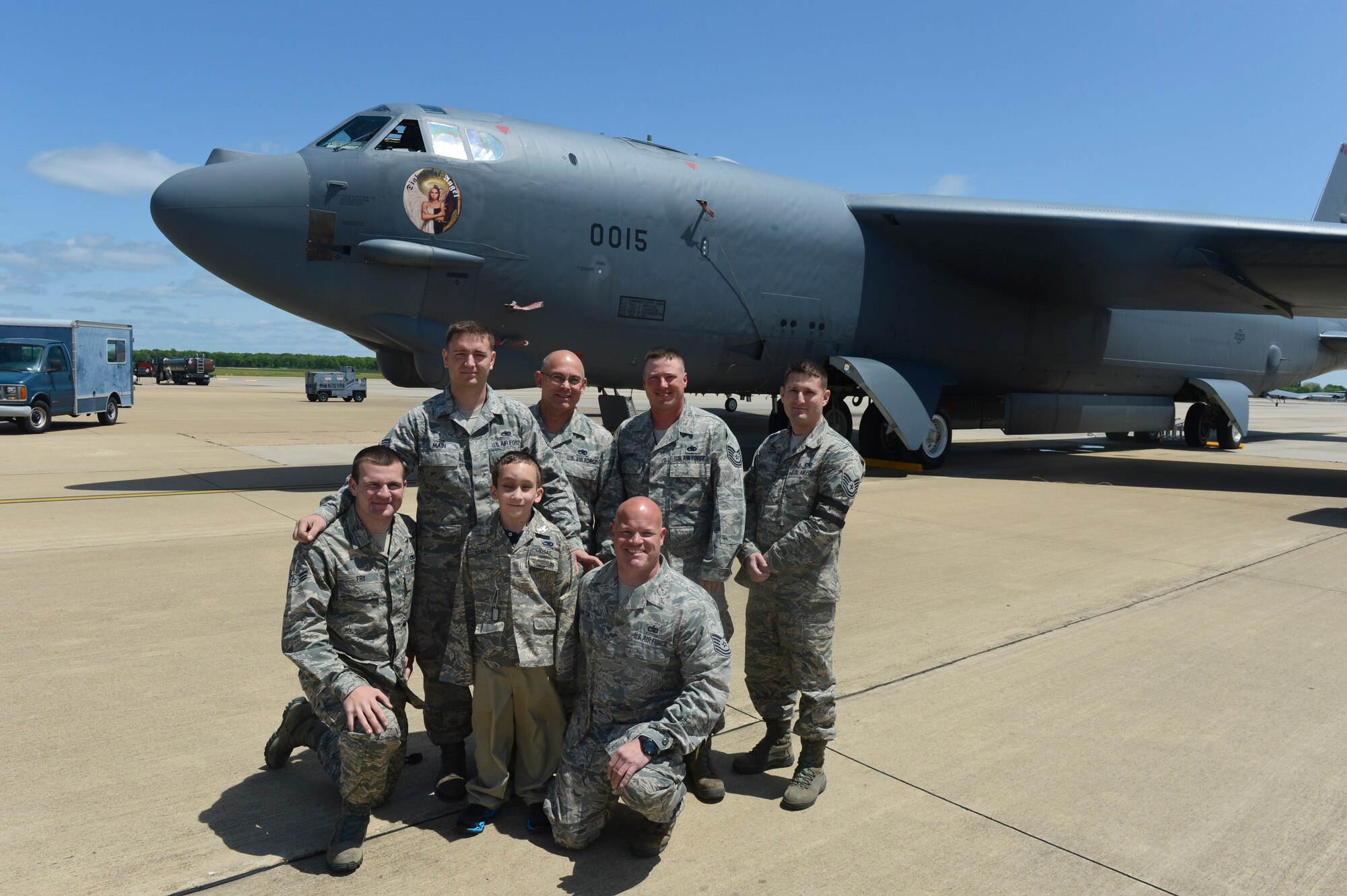 Crew chiefs pose with Hunter Tomlin, 8, in front of a B-52H Stratofortress that bears his name on Barksdale Air Force Base, La., April 24, 2013. Tomlin was diagnosed with neurofibromatosis when he was only 3 months old. (U.S. Air Force photo/Senior Airman Micaiah Anthony)
