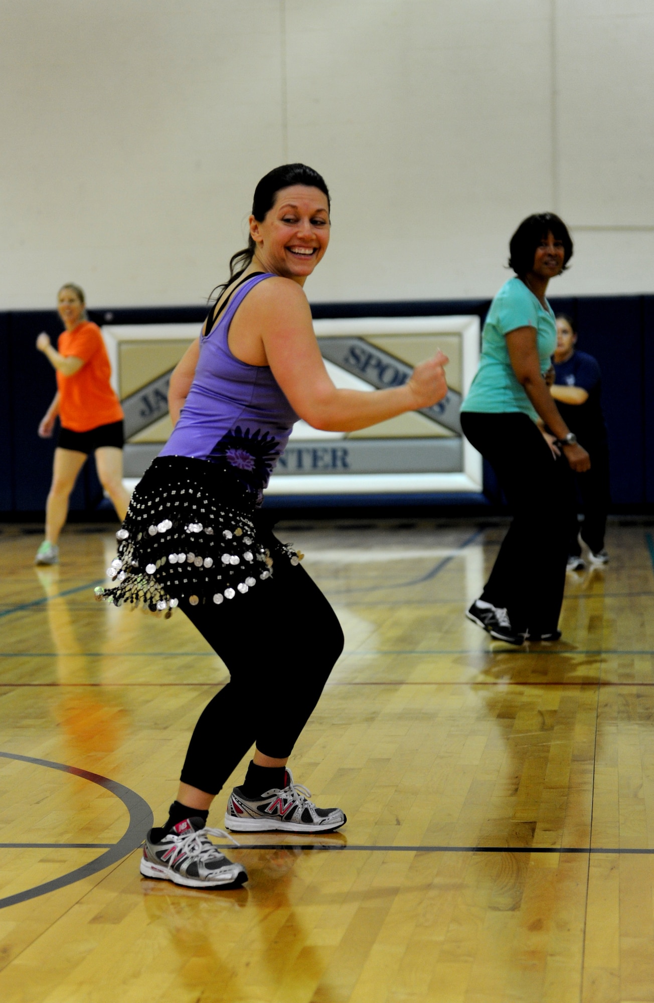 A participant in Zumbathon dances to high-energy music at James Gym April 19. Zumbathon was hosted by the Sexual Assault Response Coordinator, Pamela Dorsey and her victim advocates in an effort to bring attention to the issue of sexual assault. The Zumba classes ran consecutively from 11 a.m. to 4 p.m. (U.S. Air Force photo/Staff Sgt. Maria Bowman)