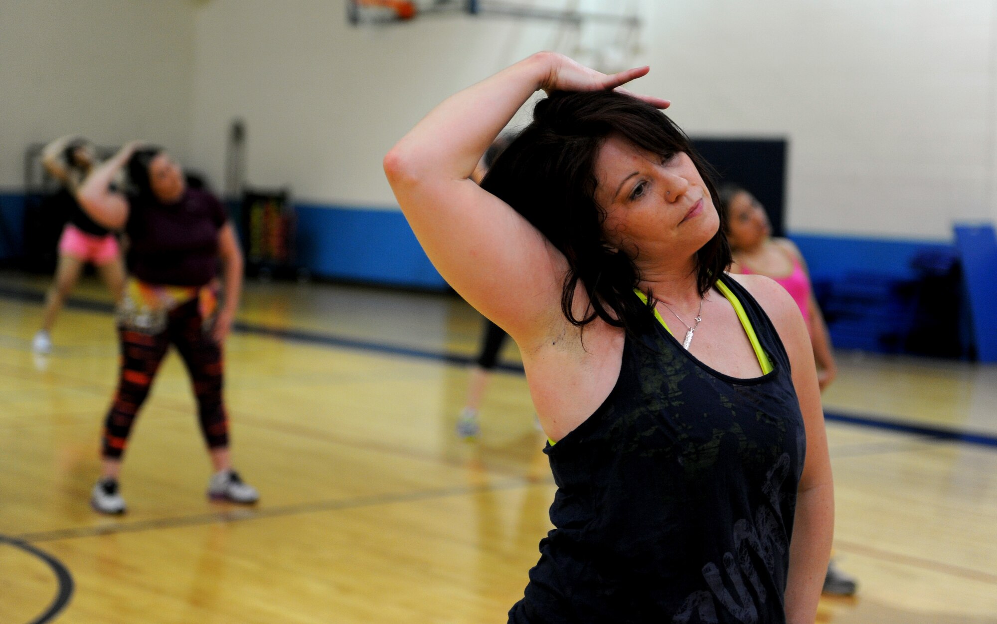 Jodie Boyer, a certified Zumba instructor, teaches a class during Zumbathon April 19 at James Gym. Zumba is a high-intensity dance workout created by Beto Perez, who is a native of Colombia. The Zumbathon was organized as a way to bring sexual assault awareness to the base. (U.S. Air Force photo/Staff Sgt. Maria Bowman)