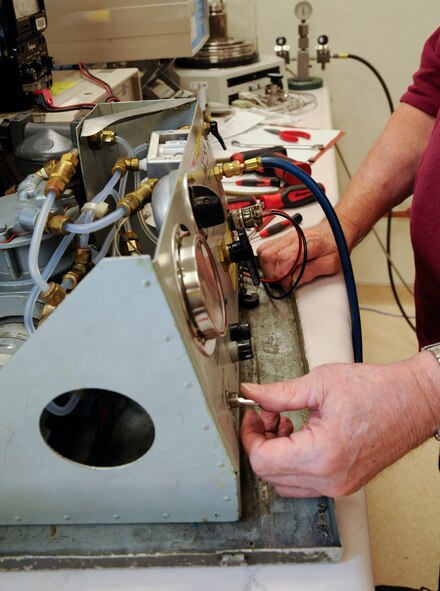 Tony Foust, Precision Measurement Equipment Laboratory technician, performs a radar pressurizing test on Barksdale Air Force Base, La., April 24, 2013. The PME lab supports more than 7,500 items of test measurement and equipment used daily on the flightline and in maintenance backshops. (U.S. Air Force photo/Airman 1st Class Andrew Moua)