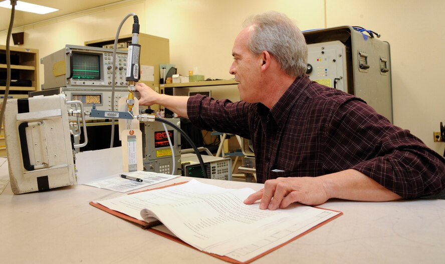 Mike Maxwell, Precision Measurement Equipment Laboratory technician, uses a transponder test set on Barksdale Air Force Base, La., April 24, 2013. The test set is used on aircraft transponders to simulate conditions during flight to see if they are working correctly. (U.S. Air Force photo/Airman 1st Class Andrew Moua)