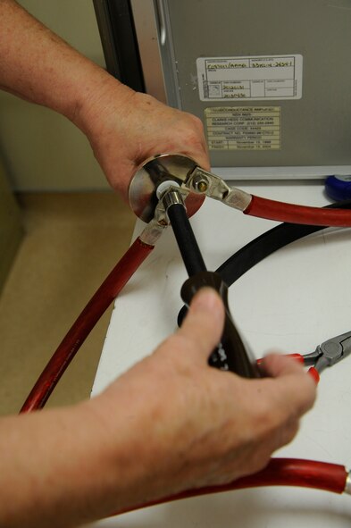 Gwen Acor, Precision Measurement Equipment Laboratory technician, calibrates the amperage on an 8100 transconductance amplifier on Barksdale Air Force Base, La., April 24, 2013. The PME lab supports more than 7,500 items of test measurement and equipment used daily on the flightline and in maintenance backshops. (U.S. Air Force photo/Airman 1st Class Andrew Moua)