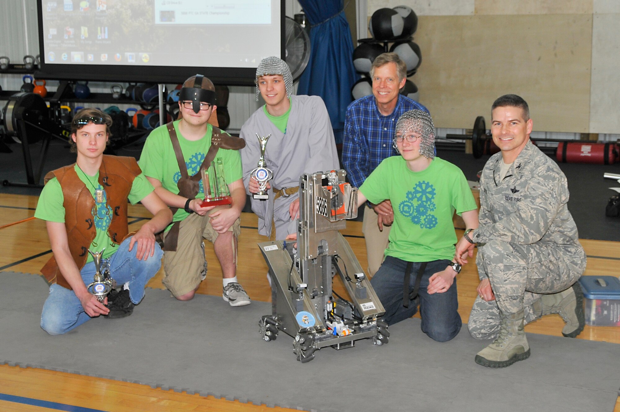 From left, Josh Freiberger, Volunteer State Community College; Joshua Garnto, Friendship Christian School; Ryan Baxter, Central Magnet School; Jere Matty, AEDC STEM Coordinator; Chance Ferguson, Eagleville High School, and AEDC Commander Col. Raymond Toth gathered after the team R.P.G.’s demonstration at AEDC’s Fitness Center. (Photo by Jacqueline Cowan)