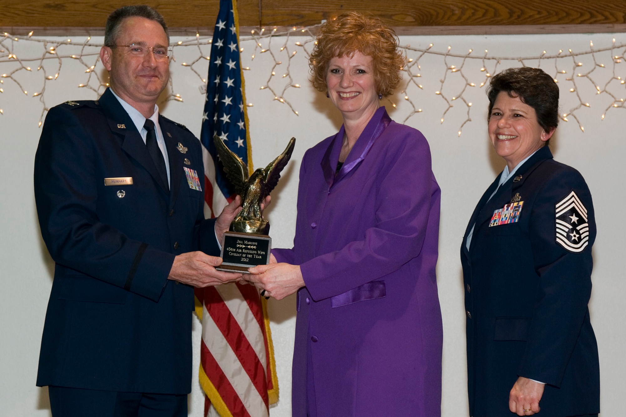 GRISSOM AIR RESERVE BASE, Ind. -- Jill Marconi, Grissom Airman and Family Readiness Center director, receives a 434th Air Refueling Wing Civilian of the Year award from Col. Bryan Reinhart, 434th ARW vice commander, at an awards social near Grissom April 13. The event recognized the 434th ARW annual award winners for 2012. (U.S. Air Force photo/Senior Airman Andrew McLaughlin)
