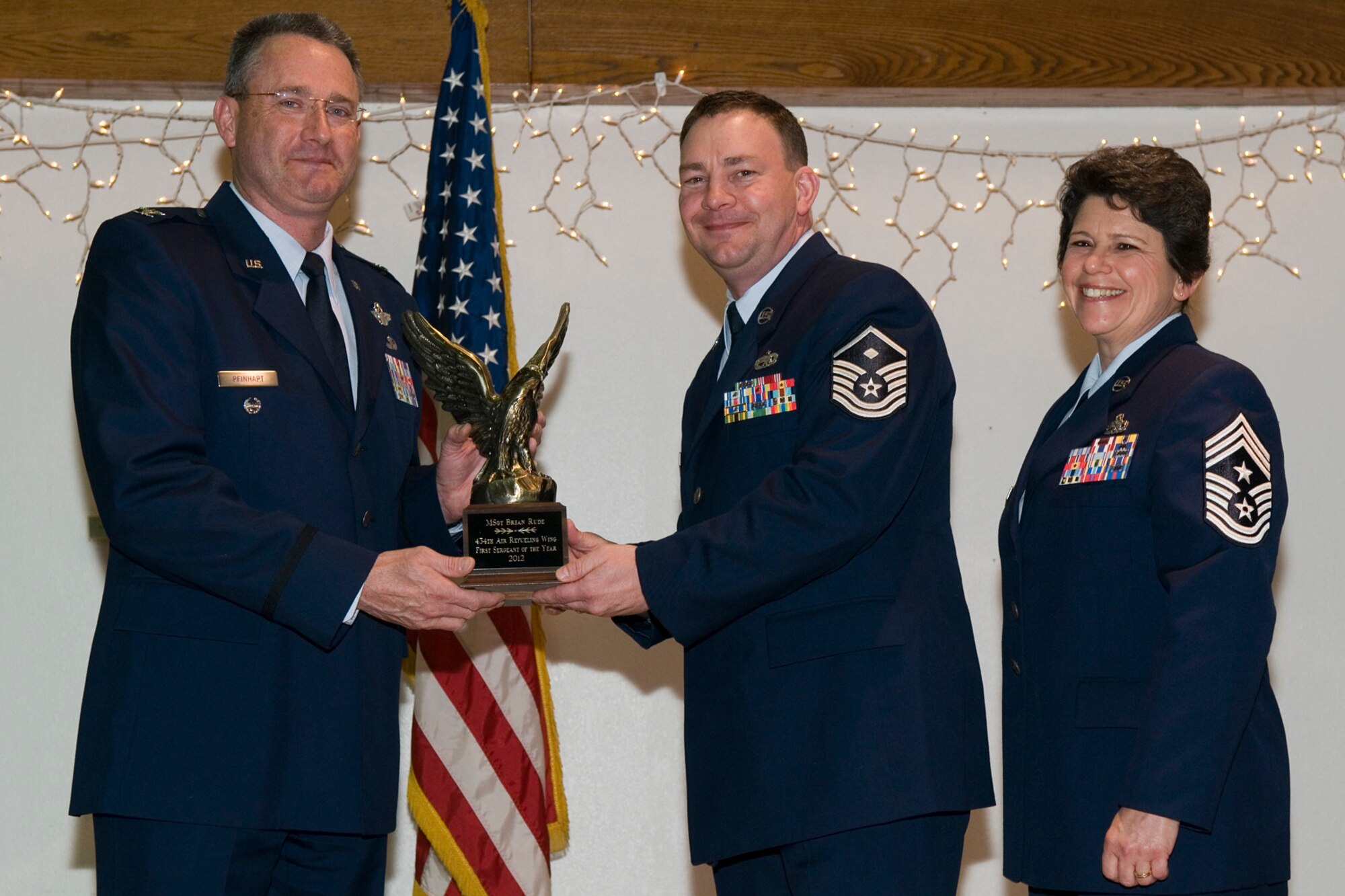 GRISSOM AIR RESERVE BASE, Ind. -- Master Sgt. Brian Rude, 434th Logistics Readiness Squadron first sergeant, receives a 434th Air Refueling Wing First Sergeant of the Year award from Col. Bryan Reinhart, 434th ARW vice commander, at an awards social near Grissom April 13. The event recognized the 434th ARW annual award winners for 2012. (U.S. Air Force photo/Senior Airman Andrew McLaughlin) 
