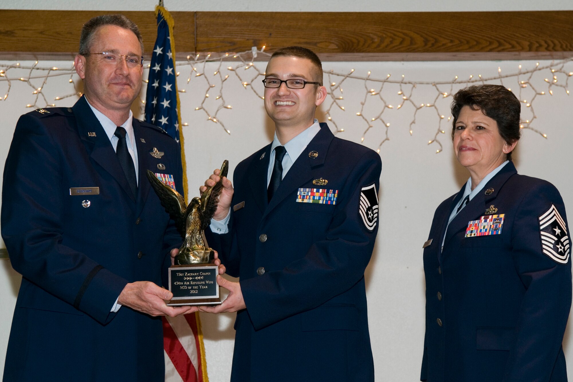 GRISSOM AIR RESERVE BASE, Ind. -- Master Sgt. Zachary Chapin, 434th Maintenance Squadron jet engine mechanic, receives a 434th Air Refueling Wing Noncommissioned Officer of the Year award from Col. Bryan Reinhart, 434th ARW vice commander, at the at an awards social near Grissom April 13. The event recognized the 434th ARW annual award winners for 2012. (U.S. Air Force photo/Senior Airman Andrew McLaughlin)  