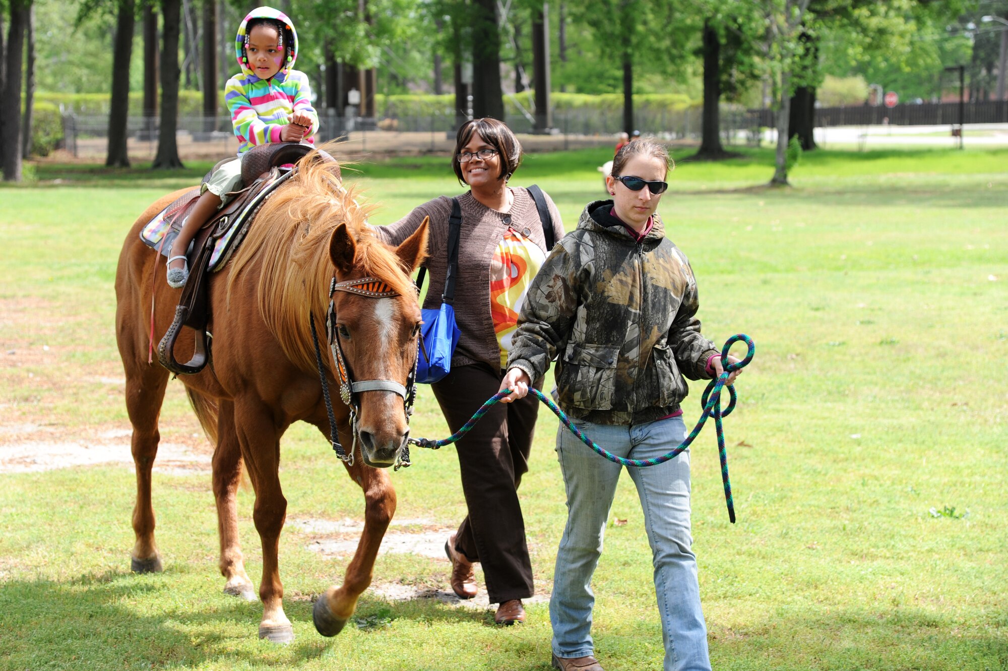 A Team Seymour child rides a horse during the Month of the Military Child celebration at the Youth Center on Seymour Johnson Air Force Base, N.C., April 20, 2013.  The event also had other animals, such as rabbits, mules and alpacas, for the children to interact with.  (U.S. Air Force photo by Airman 1st Class Brittain Crolley/Released)