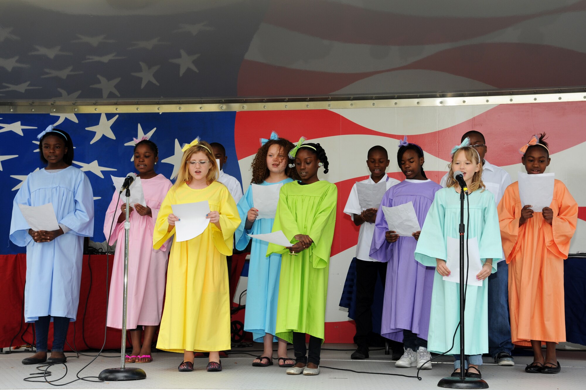 Children from the Youth Center choir sing during the Month of the Military Child celebration at the Youth Center on Seymour Johnson Air Force Base, N.C., April 20, 2013.  The free event was held to recognize military children and families, and the important role they play in ensuring mission success.  (U.S. Air Force photo by Airman 1st Class Brittain Crolley/Released)