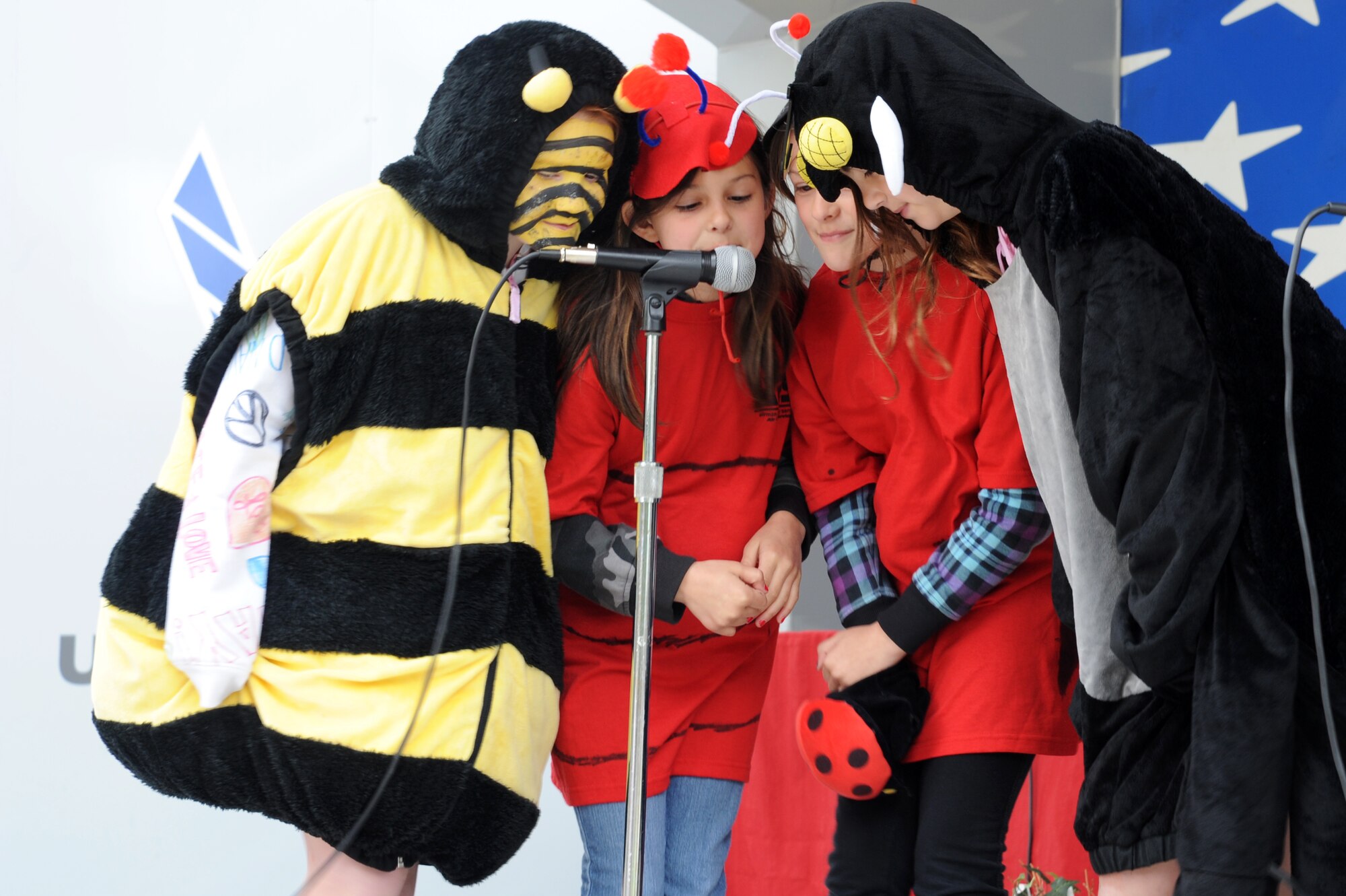 Children from the Youth Center drama club put on a play during the Month of the Military Child celebration at the Youth Center on Seymour Johnson Air Force Base, N.C., April 20, 2013.  The children demonstrated the positive effects that bugs have on the environment despite their unfriendly appearance.  (U.S. Air Force photo by Airman 1st Class Brittain Crolley/Released)
