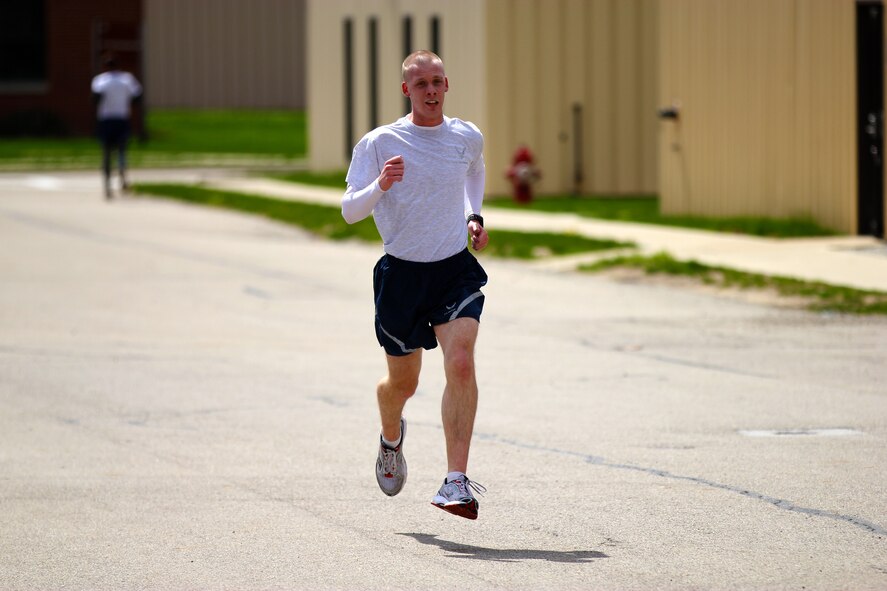 Airman First Class Dustin Snyder of the 178th Fighter Wing finishes first  in a  5k race in a time of 18:19 April 20, 2013, at Springfield Air National Guard Base, Ohio. The 5k run was part of a Fitness Expo that was open for base member participation. 