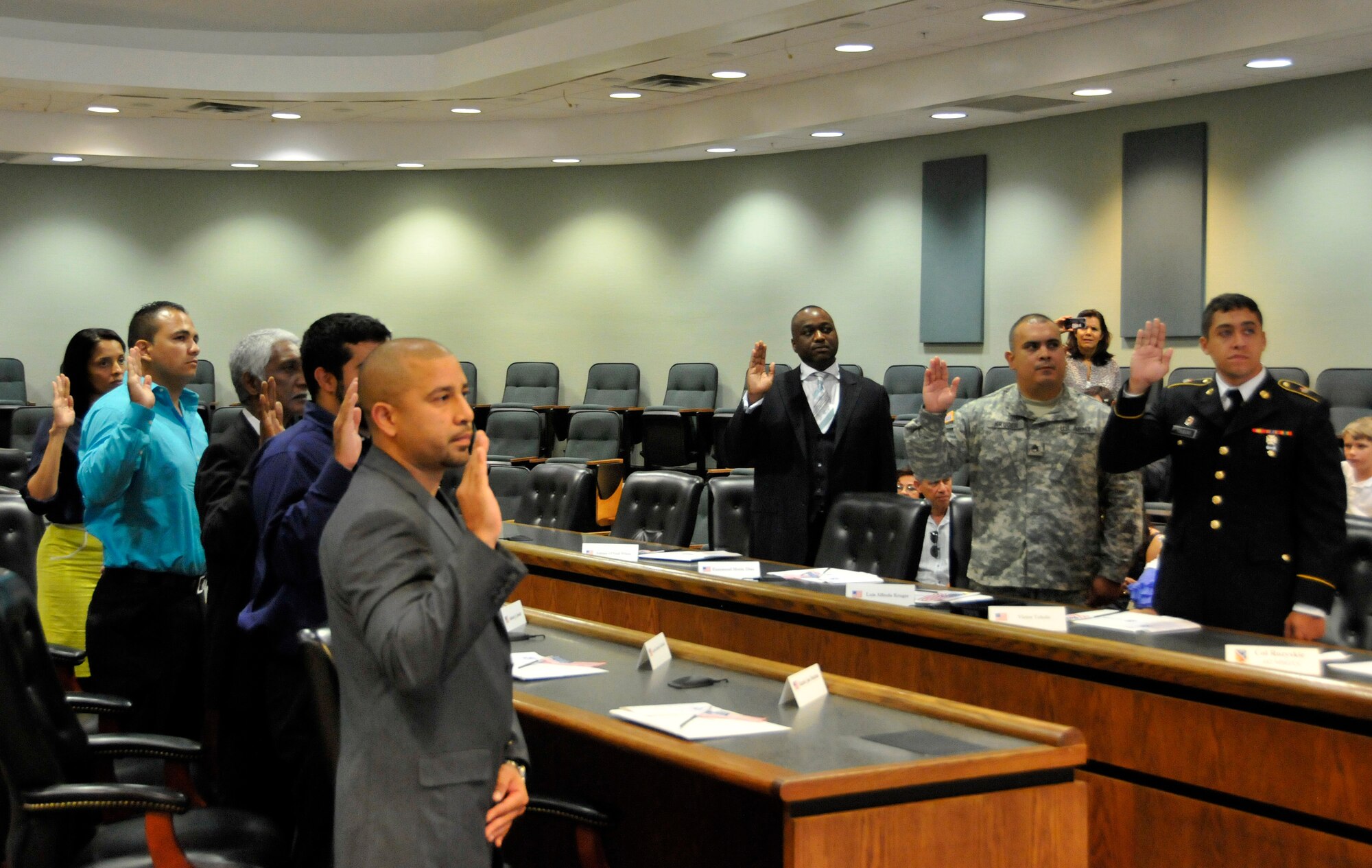 Eight new U.S. citizens take the Oath of Allegiance during a naturalization ceremony at Homestead Air Reserve Base, Fla., April 23. The group of new U.S. citizens also consisted of current members of the U.S. armed forces as well as veterans. (U.S. Air Force photo/Senior Airman Nicholas Caceres)