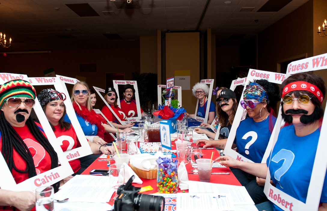 Spouses from the 28th Civil Engineer Squadron dress up as pieces of the board game “Guess Who,” during the spouses dining-in event at the Dakota’s Club on Ellsworth Air Force Base, S.D., April 20, 2013. Spouses of officers, enlisted members and civilians were invited to participate in a “Game Night” themed event to help raise morale and encourage a supportive community. (U.S. Air Force photo by Airman 1st Class Kate Thornton-Maurer/Released)