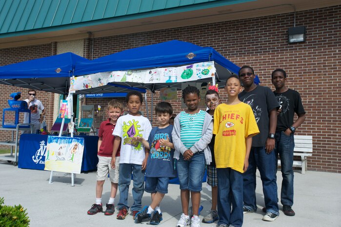 Children from the Joint Base Charleston – Weapons Station Child Development Center enjoy some time in the sun  while displaying their artwork at the Children’s Art Gala, April 17, 2013, at JB Charleston – Weapons Station, S.C. The event was to encourage, inspire and promote the creative arts of the children at the Child Development Center at JB Charleston – WS. (U.S. Air Force photo / Airman 1st Class Tom Brading)